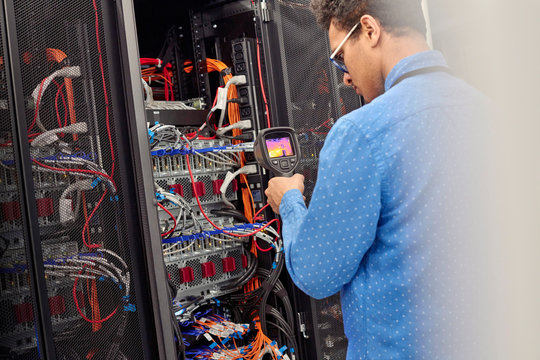 Fulltec technician inspecting network infrastructure